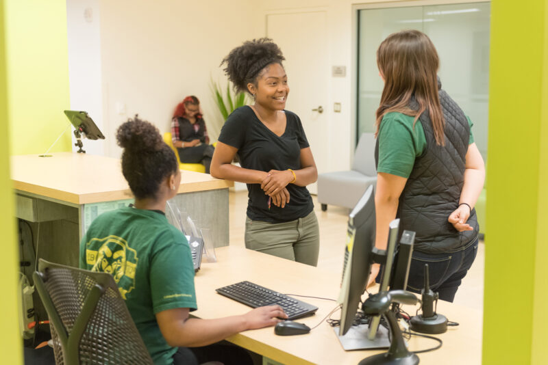 Three students talking at the Career Center at Colorado State University.